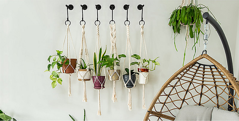 woman using hanging plants hardware