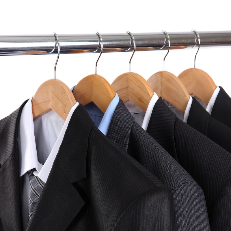 Suits hanging from closet rod