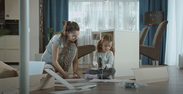 Mom and daughter using power tools