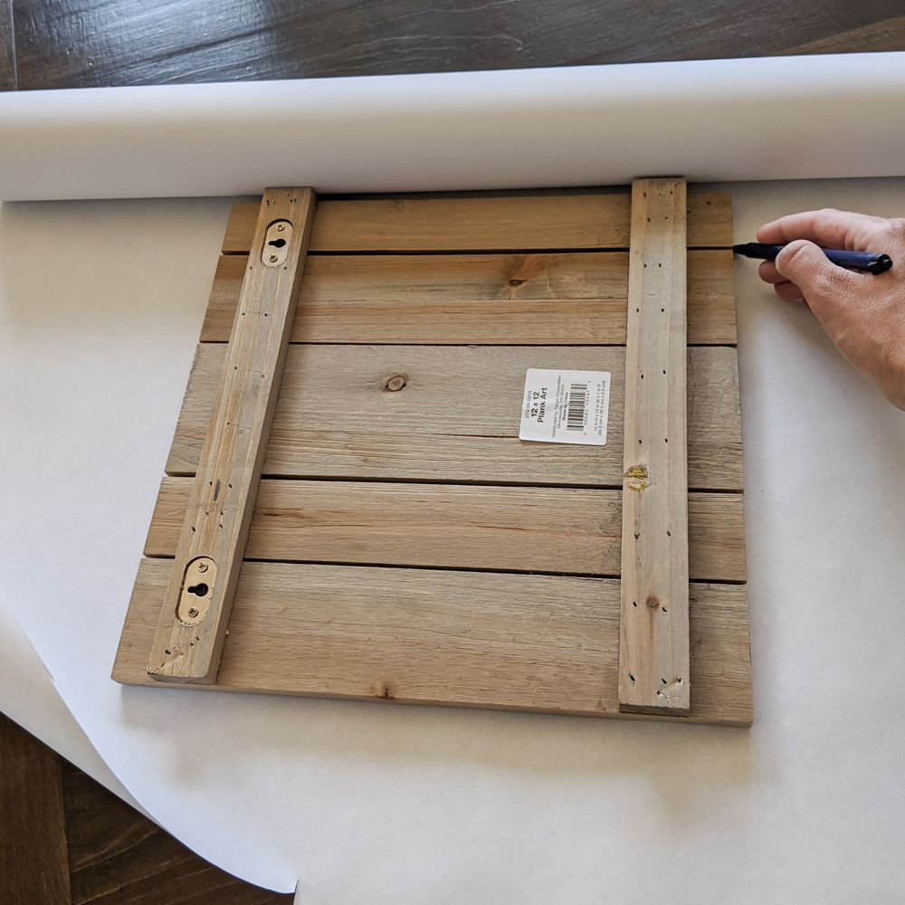 Easy DIY for hanging a roll of easel paper on the wall